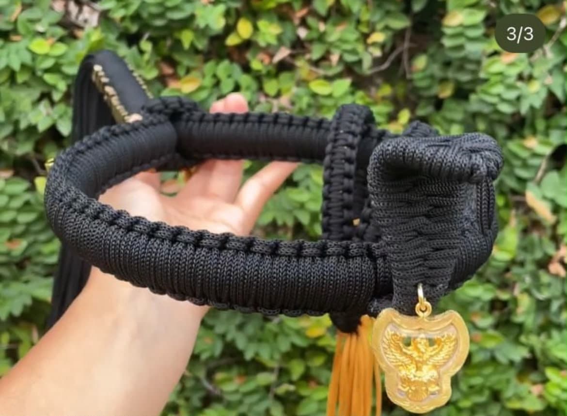 Black with a gold amulet